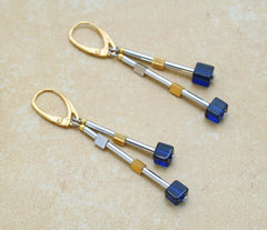 Elegante Ohrringe mit vergoldeten und rhodinierten 925 Silber und blauem Bernstein