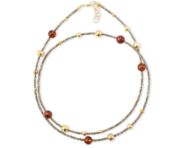 Langes Collier mit Hämatit, vergoldeten Kugeln und Bernstein in Cognacfarbe