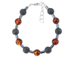 Schwarzes Bernstein Armband mit glitzernden Zirkonen