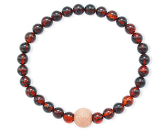 Armband mit Bernstein in Kirschfarbe und vergoldeter diamentierter Silberkugel