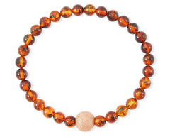 Armband mit Bernstein in Cognacfarbe und vergoldeter diamentierter Silberkugel