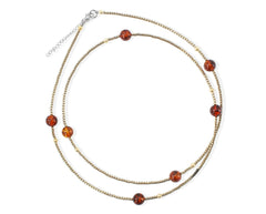Lange zierliche Bernstein Kette mit Hämatitperlen und Bernstein in Cognacfarbe